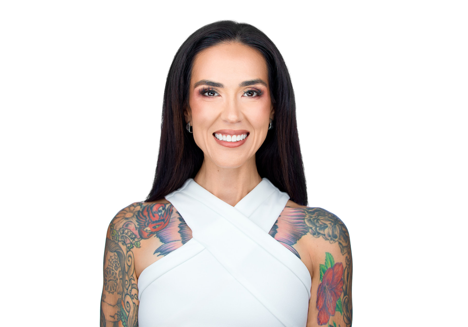 Dani Raschel Chou portrait, smiling, white top, tattooed arms.
